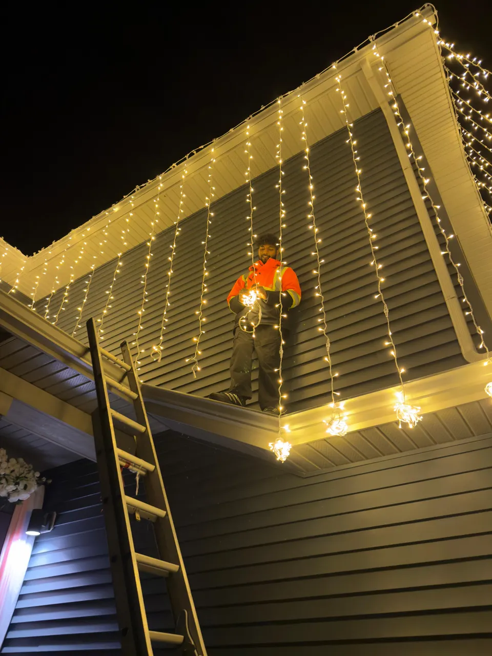 Edmonton Wedding Lights team installing string lights